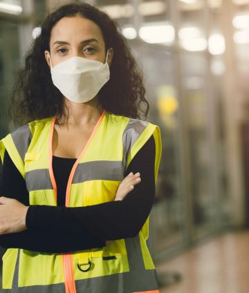 Female worker vest and face mask