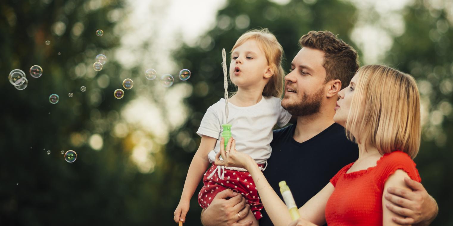 Family blowing bubbles