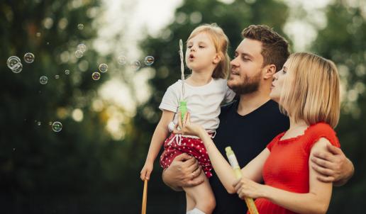 Family blowing bubbles