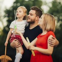 Family blowing bubbles